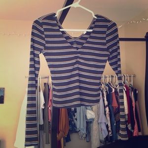 A black long sleeve v neck with stripes